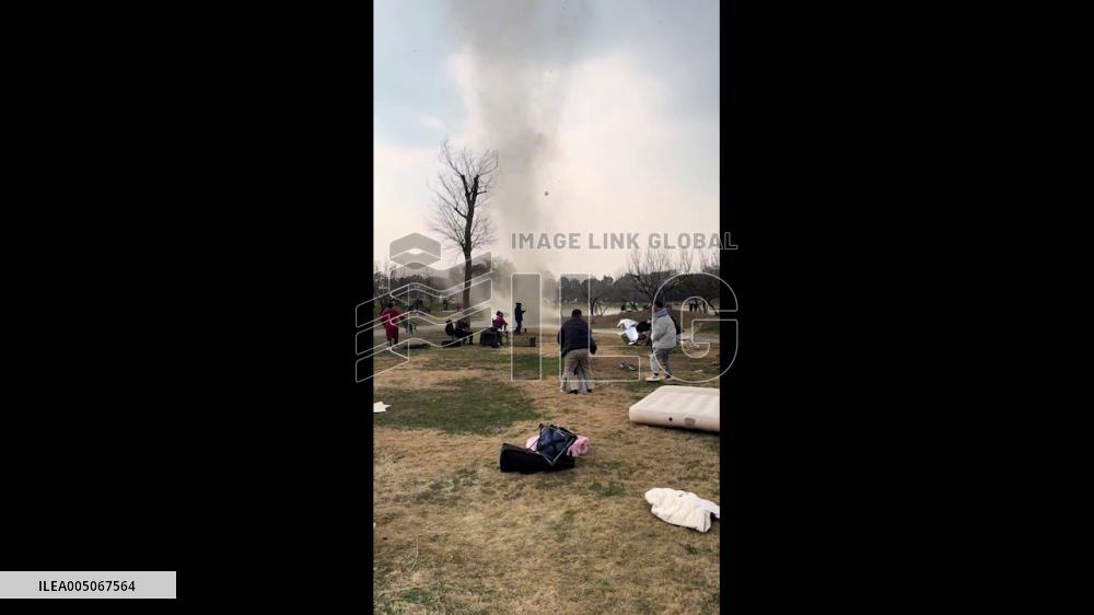 China: Dust Devil Sweeps Through Chengdu Park, Lifting Debris