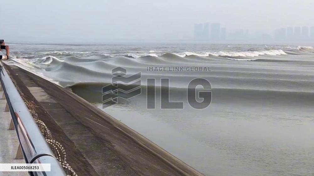 China: Qiantang River Tidal Bore Roars Upstream in Zhejiang