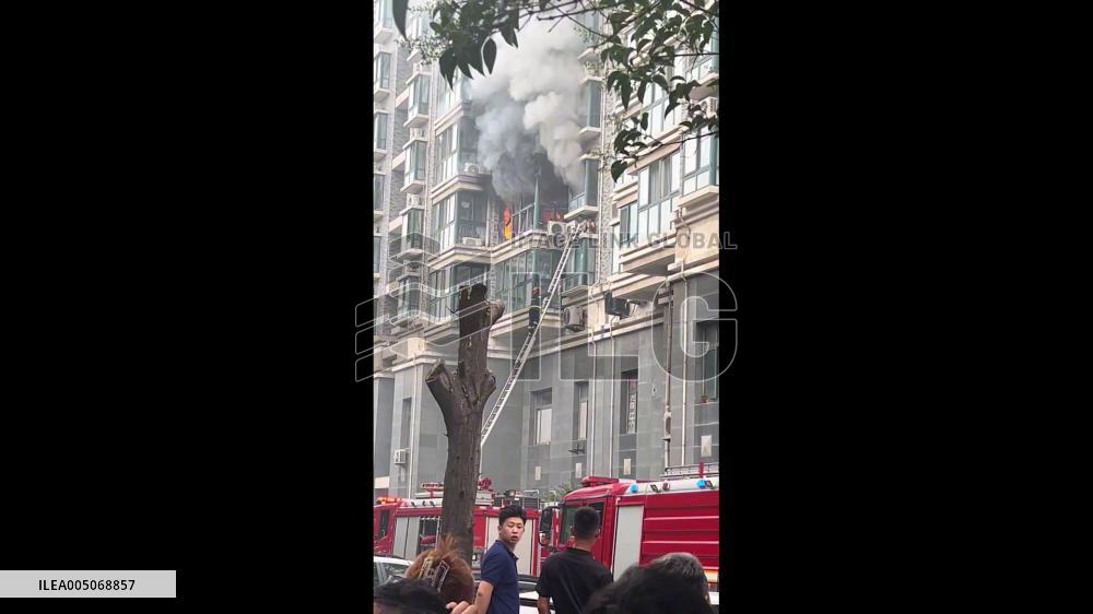 China: Girl Rescued From Burning Apartment in Jinan