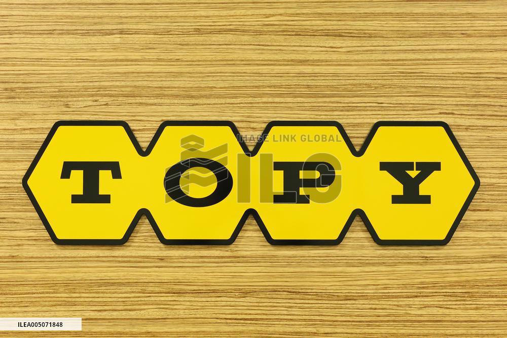 Topy Industries signboard and logo