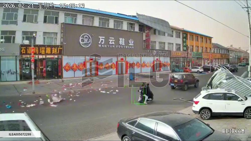 China: Metal Sheet Falls From Building Onto Passing Vehicles in Windy Inner Mongolia