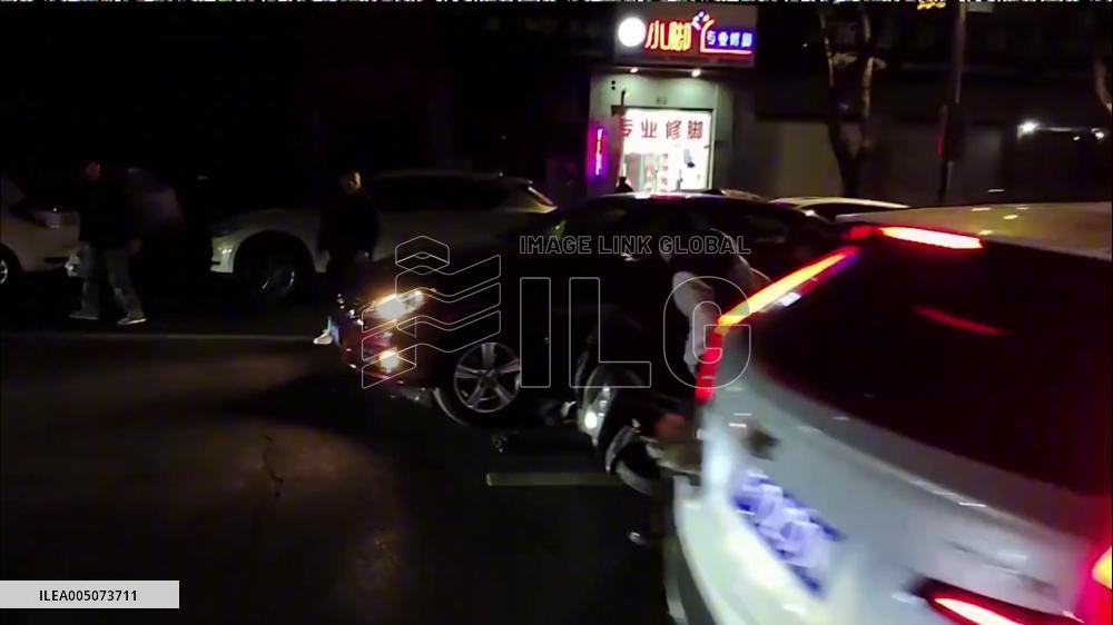 China: Bystanders Unite to Lift Car and Free Trapped Cyclist in Jiaxing