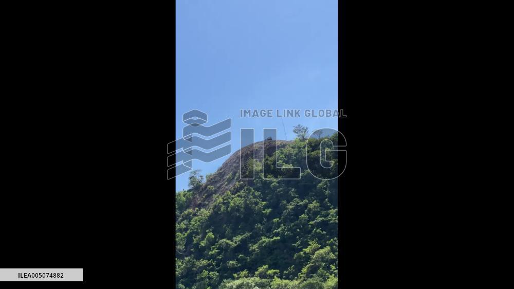 China: Car Plunges off Hilltop Into Trees in Guangdong, Shocking Onlookers