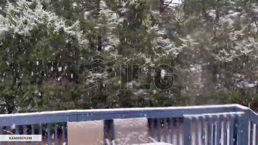 US: Late-Season Snow Blankets New Hampshire