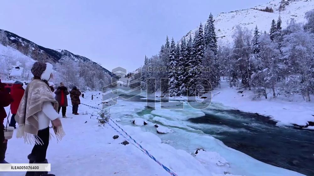China: Powerful Icy Floodwaters Surge Through River Channel at Kanas Scenic Area