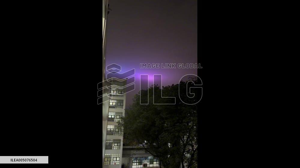 China: Guangdong Night Sky Glows in Shade of Purple