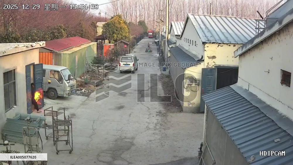 China: Man Hurls Burning Gas Cylinder Out of Home, Bystander Shuts Valve by Hand