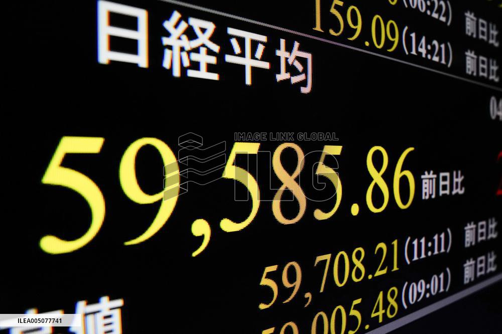 Nikkei index ends at record high