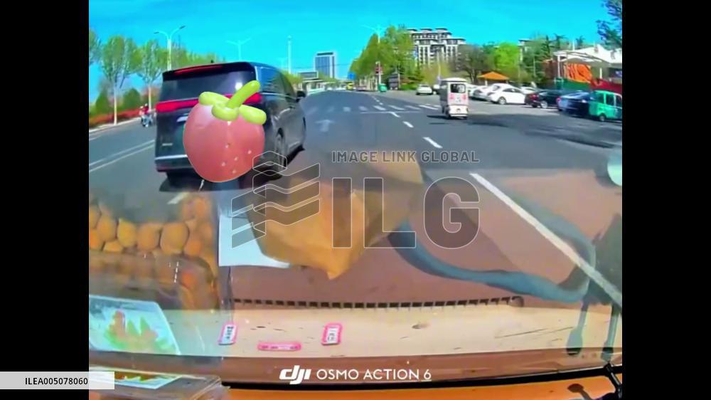 China: Riderless E-Bike Keeps Rolling On Alone After Crash in Shandong