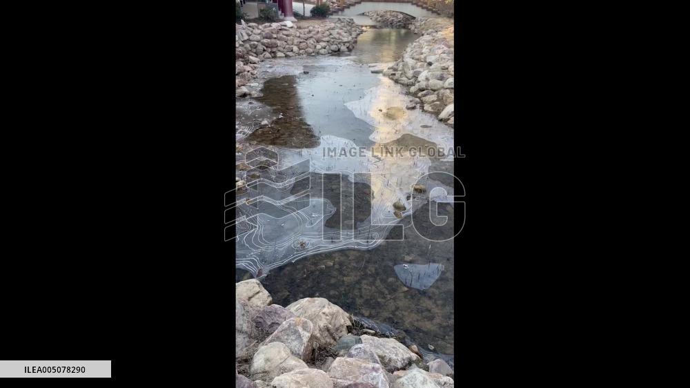 China: Ice Slowly Forms Over Flowing Water, Creating Natural Topographic Map