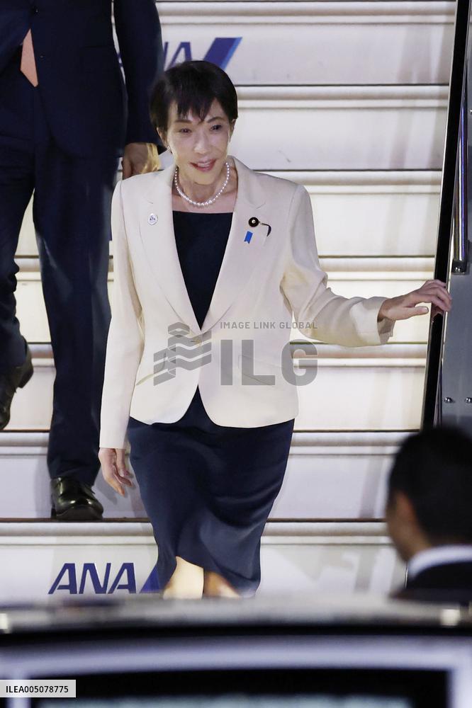 Japan PM Takaichi returns home