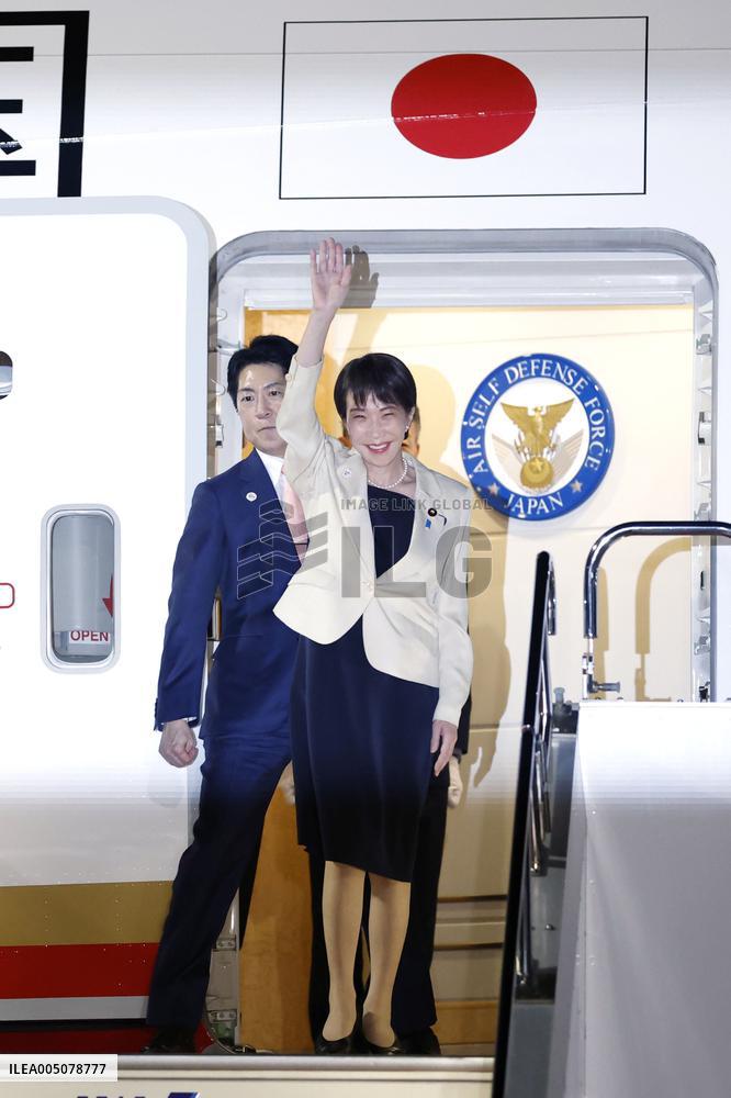 Japan PM Takaichi returns home