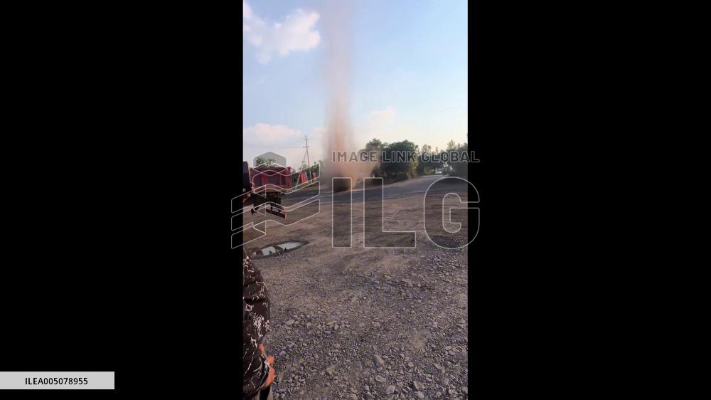 China: Massive Dust Whirlwind Spirals Into Sky Over Yongcheng, Henan