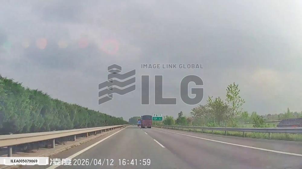 China: Car Crashes Into Highway Barrier After Truck Tire Blowout in Hunan