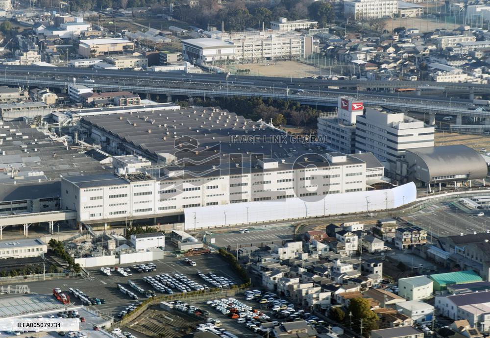 Exterior view of the Daihatsu Headquarters Plant, logo, and sign