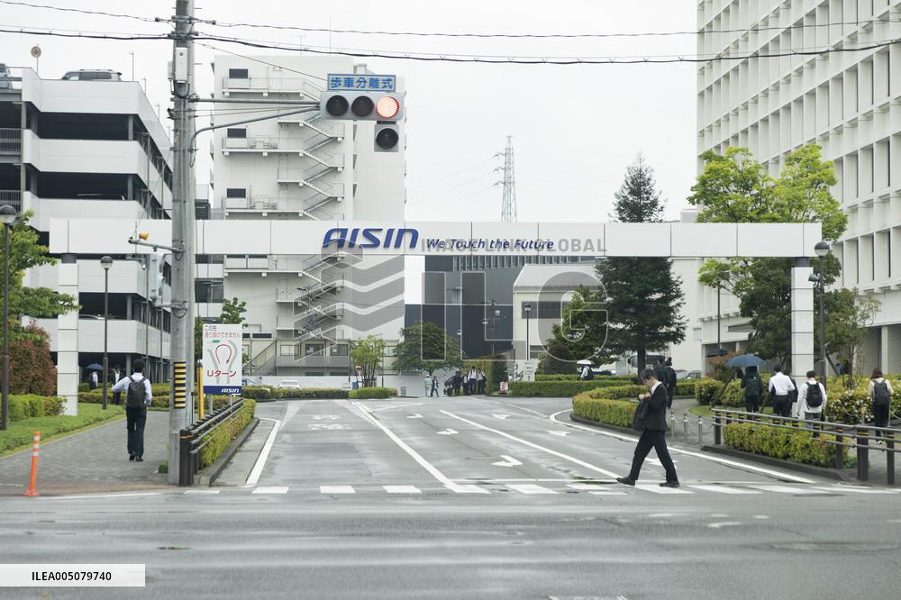 Aisin's exterior, logo, and sign