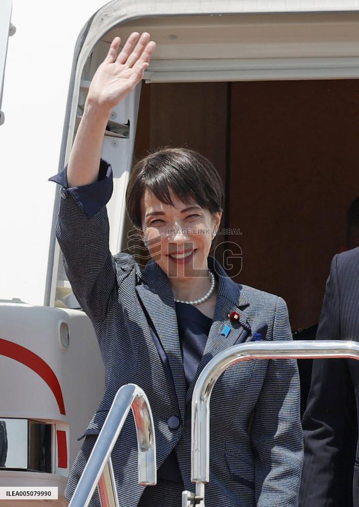 Japan PM Takaichi returns home