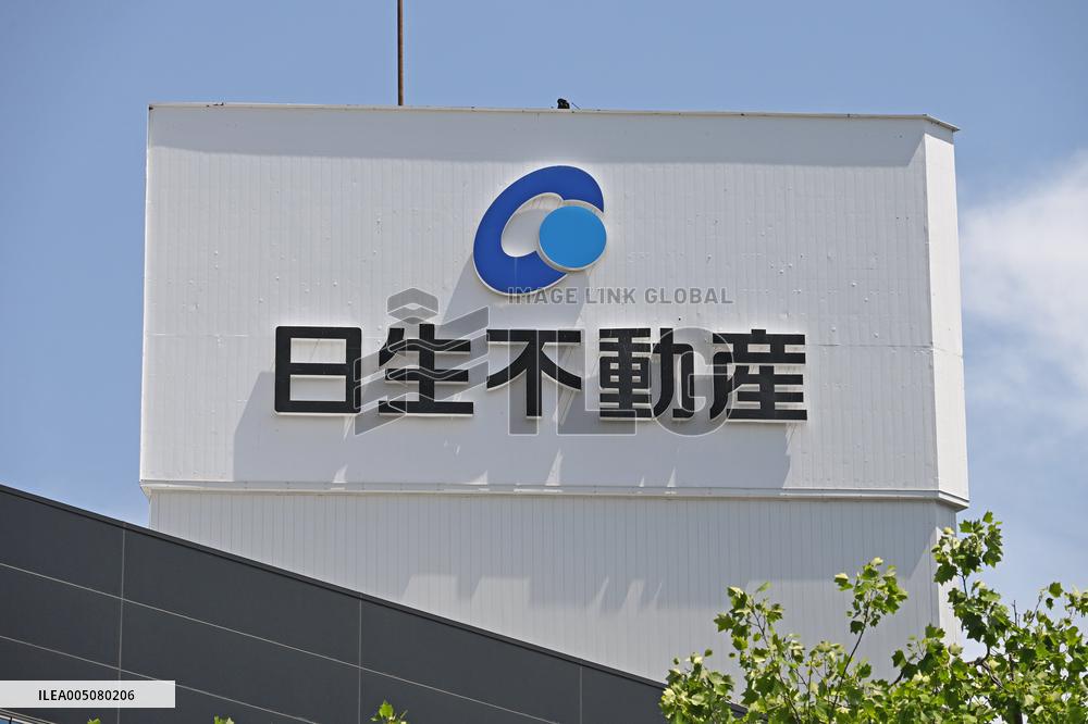Nissei Real Estate signboard and logo
