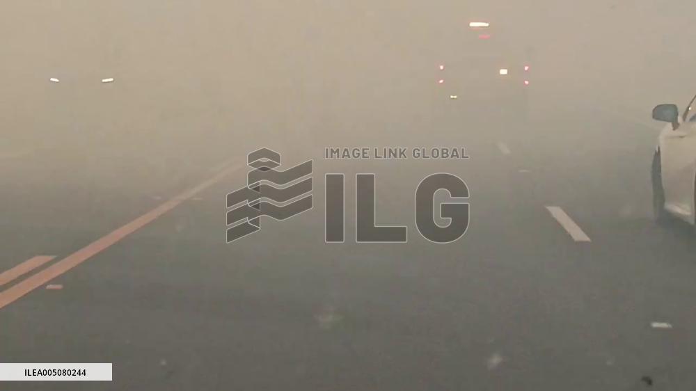 US: Drivers Navigate Smoke-Filled Roads as Bain Fire Burns in Riverside County, California