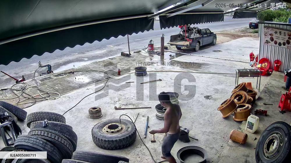 China: Terrifying Tire Blowout Caught on Camera at Guangdong Repair Shop