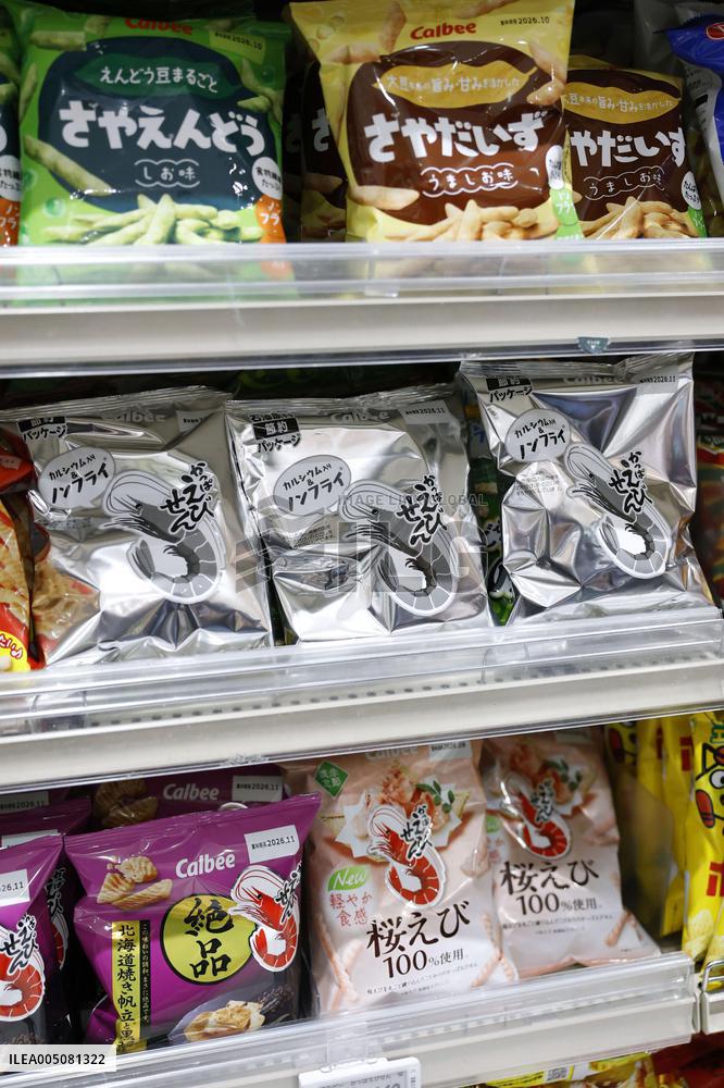 Black-and-white Calbee snack packages
