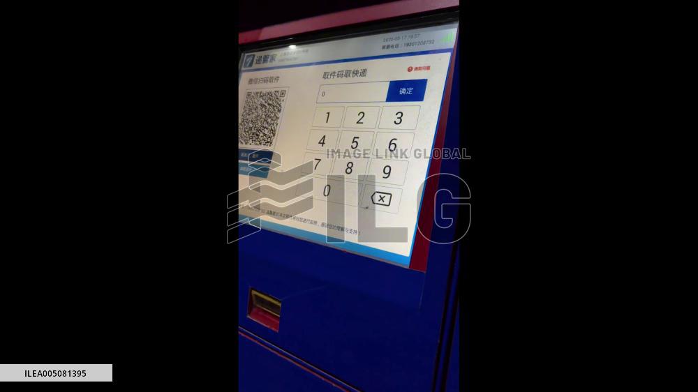 China: Mosquito Appears to Type Pickup Code on Delivery Locker Screen in Shanghai