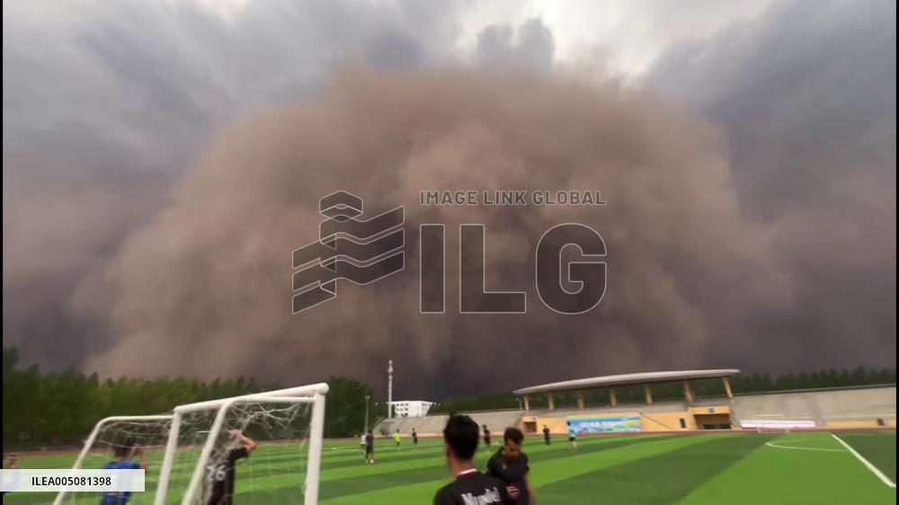 China: Massive Sandstorm Approaches School Football Field in Harbin