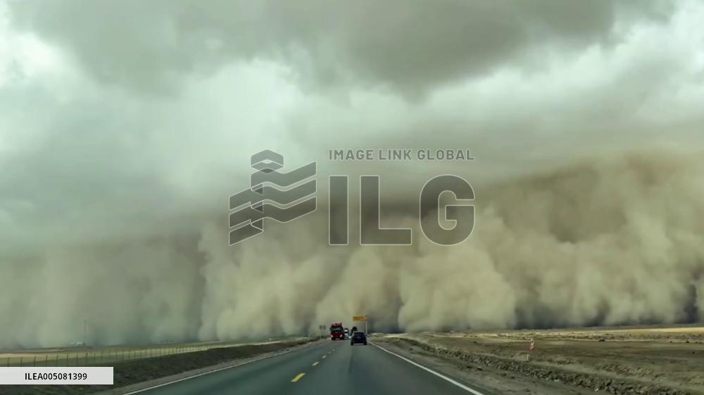 China: Towering Wall of Dust Engulfs Highway as Driver Passes Through Sandstorm in Qinghai
