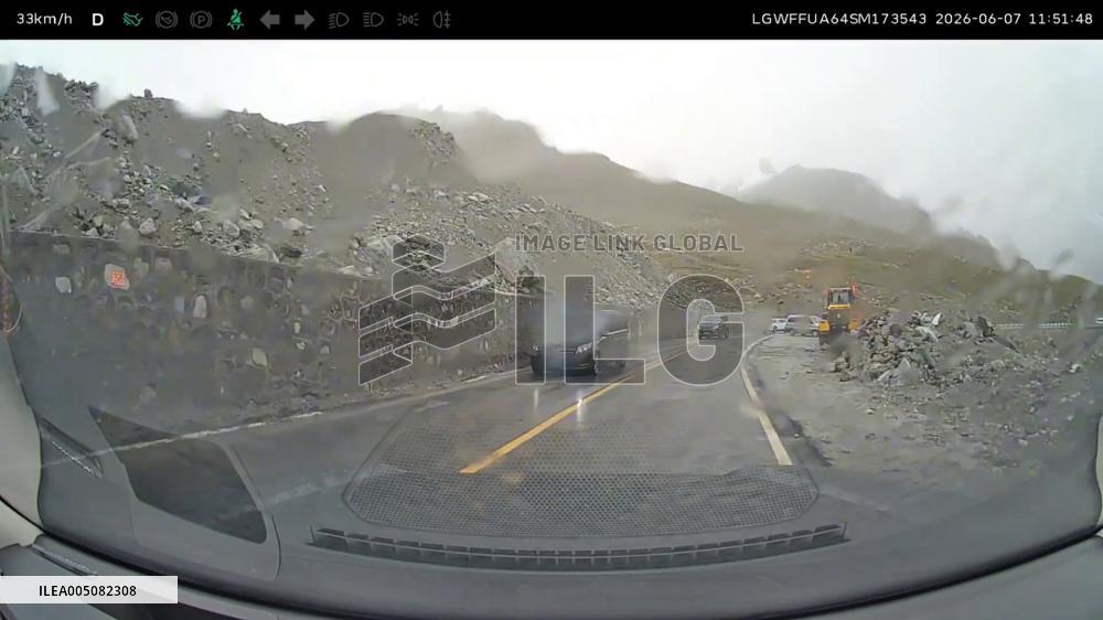 China: Huge Rock Falls Onto Road Moments After Car Passes in Xinjiang