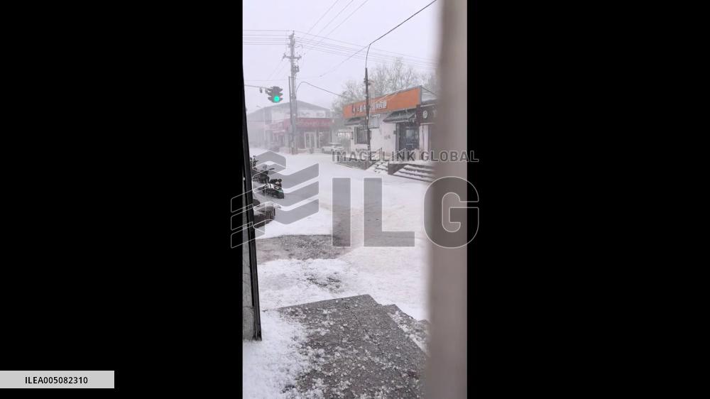 China: Summer City Transformed Into Winter Scene by Sudden Hailstorm