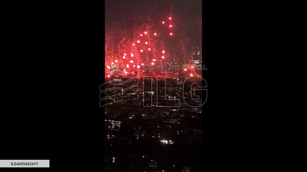 UK: Red Flares Set Off Over London in Suspected Arsenal Celebration