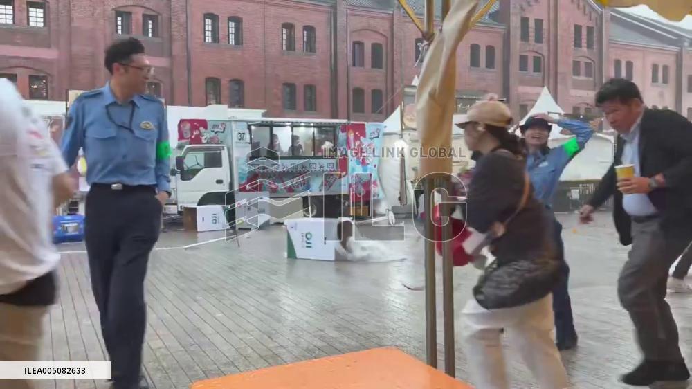 Japan: Sudden Thunderstorm Disrupts Food Event at Yokohama Red Brick Warehouse