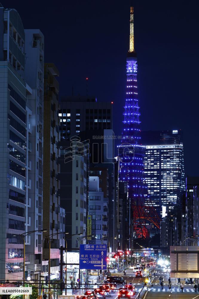 Tokyo Tower lit up in blue
