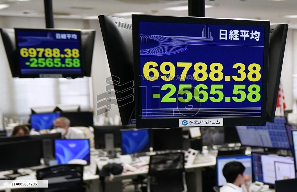 Nikkei index ends below 70,000