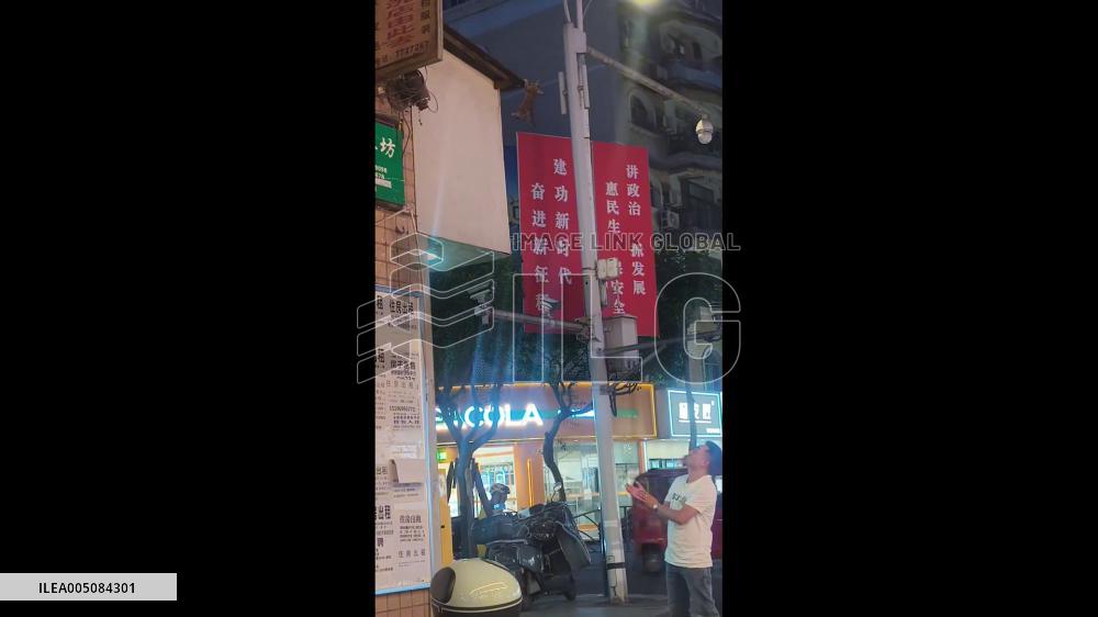China: Man Catches Cat Falling From Building in Sichuan
