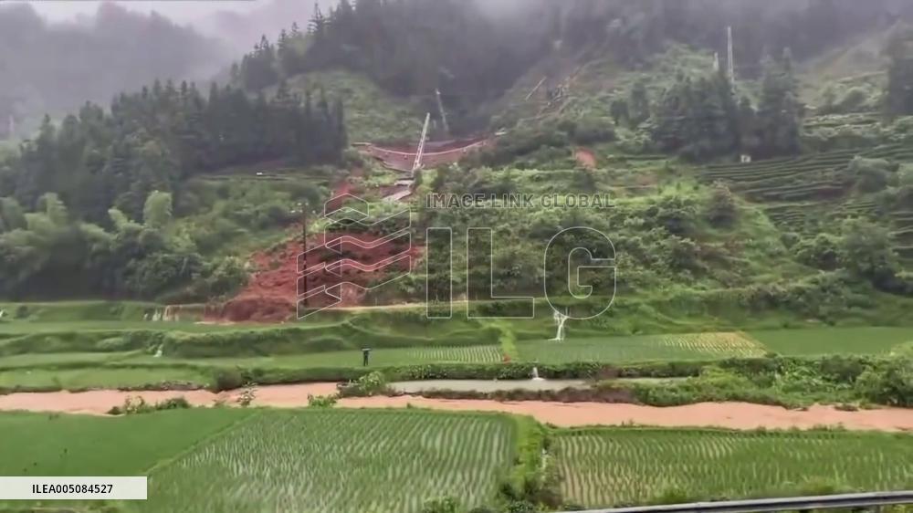 China: Landslide Sweeps Down Hillside, Bringing Down Power Tower in Guizhou