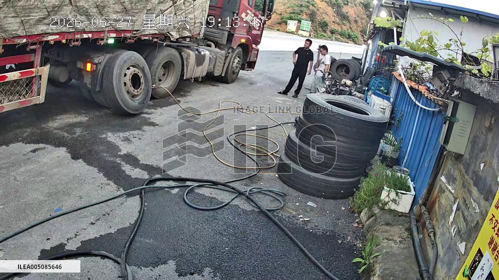 China: Truck Tire Explodes at Repair Shop, Workers Unhurt