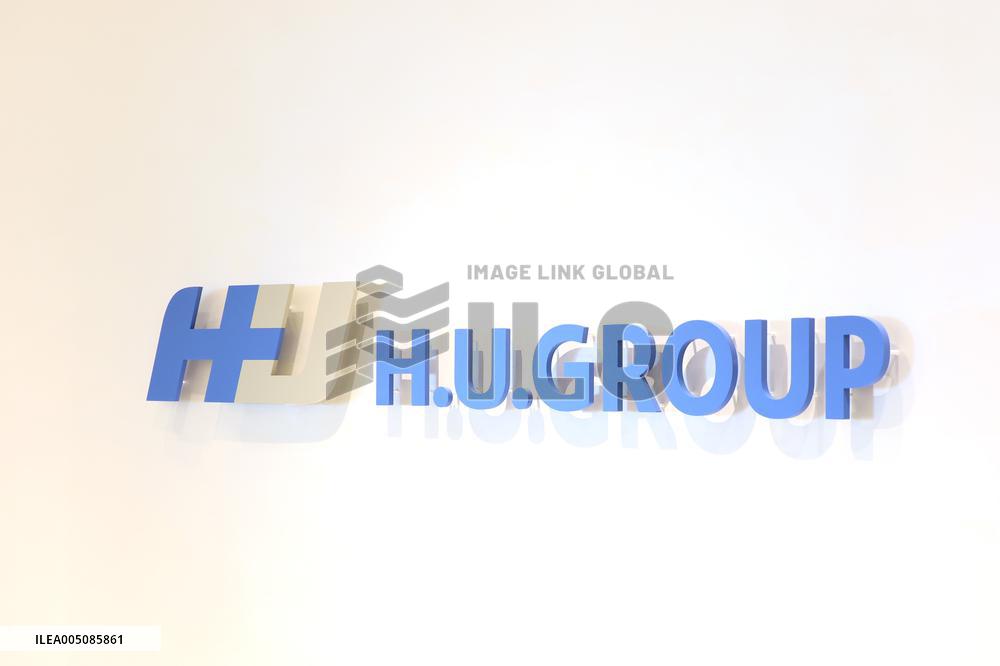 H.U. Group Holding Sign and Logo