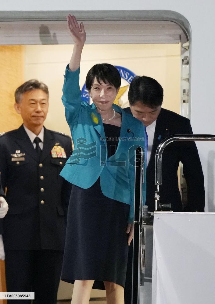 Japan PM returns home
