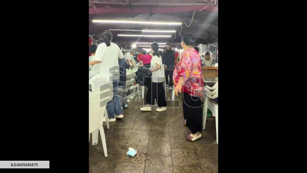 China: Sudden Storm Flips Tables, Sends Diners Scrambling at Qingdao Food Stall