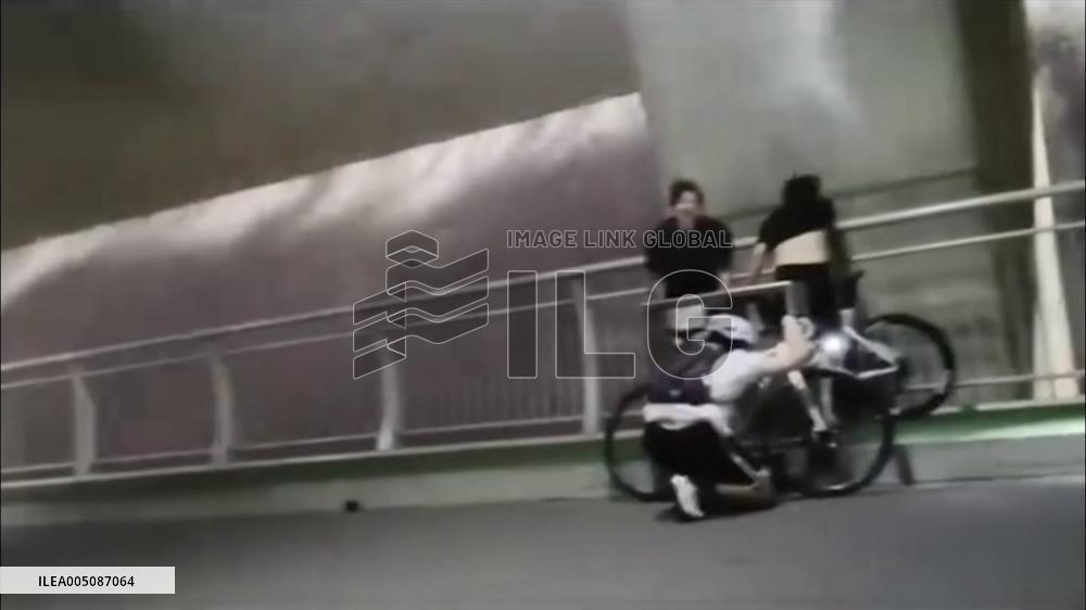 China: Cyclists Battle Fierce Winds on Nanchang Bridge