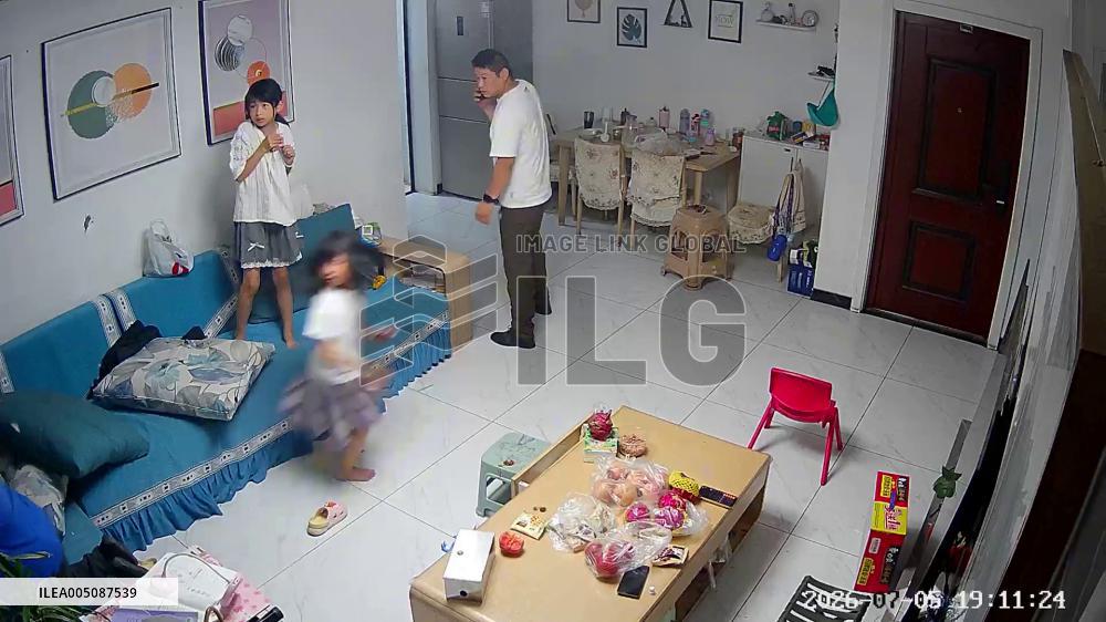 China: Powerful Winds Rip Window Screen From Home Into TV