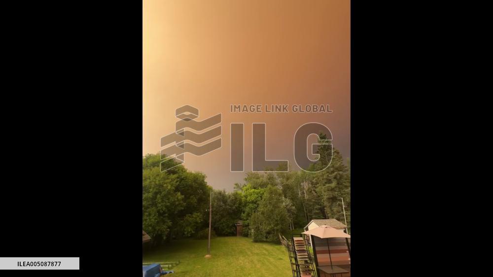 Canada: Wildfire Smoke Blankets Ontario Skies in Orange Haze