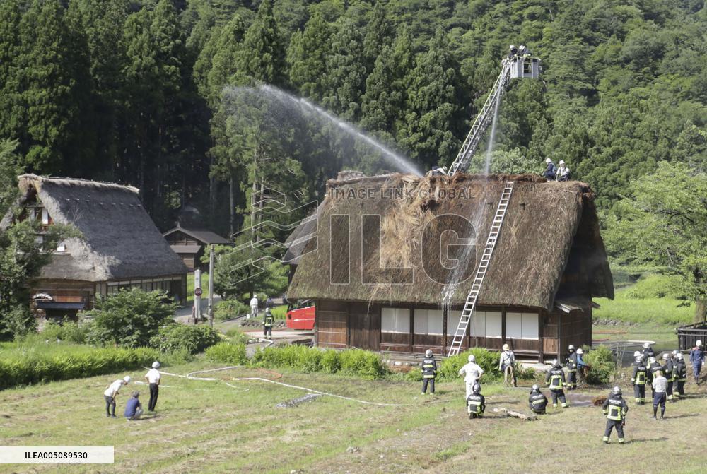 Thatched-roof house catches fire in World Heritage-listed village