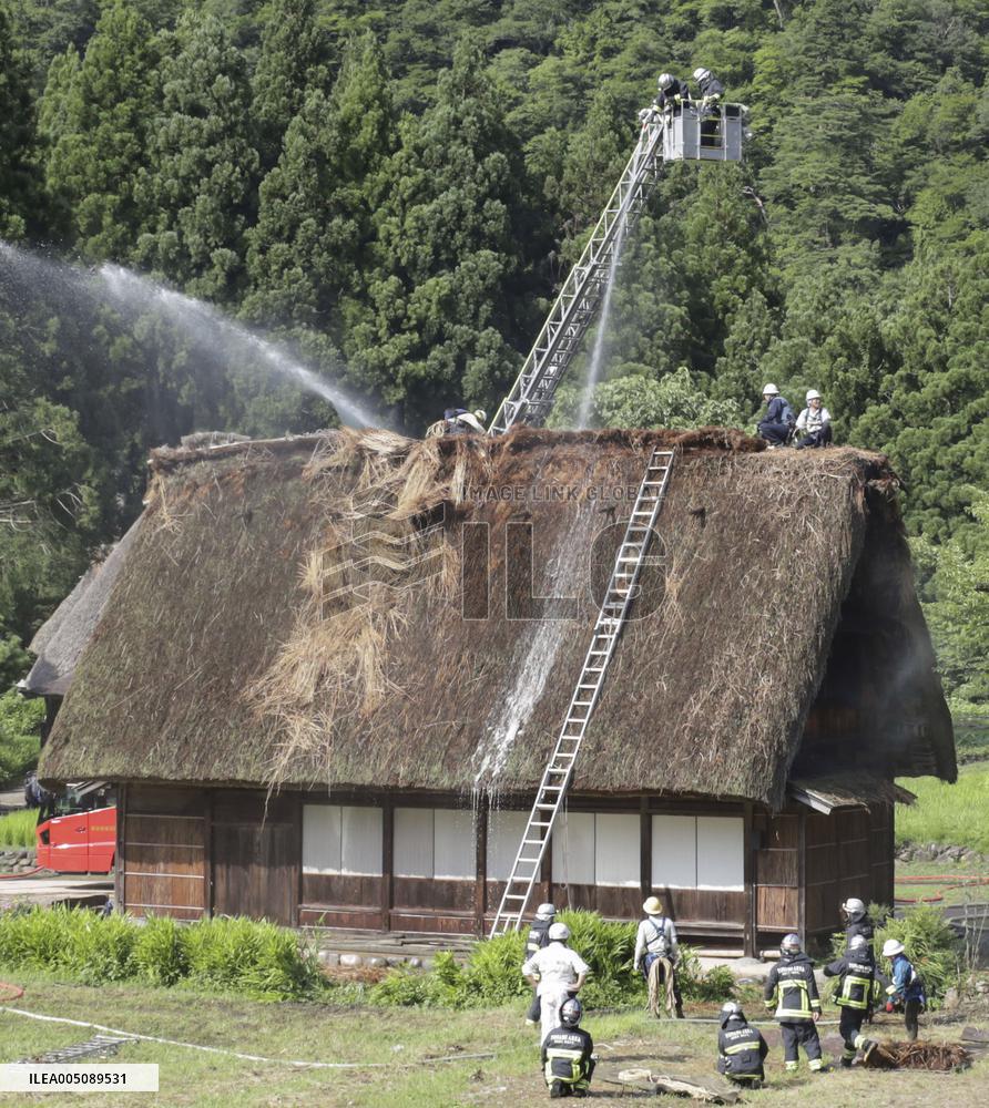 Thatched-roof house catches fire in World Heritage-listed village