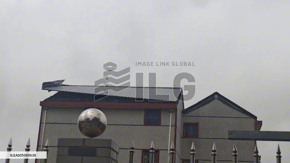 China: Typhoon Bavi Rips Metal Roof Off Residential Building in Shanghai