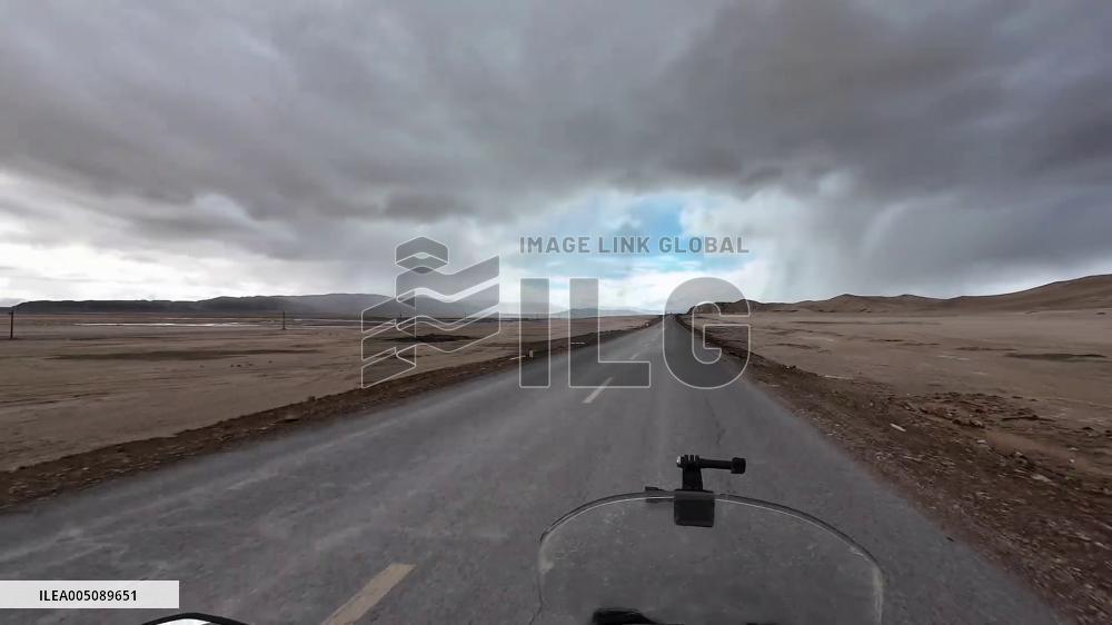 China: Motorcyclist Rides Into Sudden Hailstorm on Highway 219 in Xinjiang
