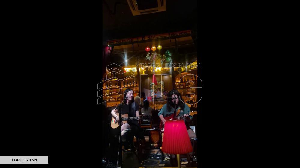 China: Flames Erupt From Woman’s Helmet During Livehouse Show in Chongqing