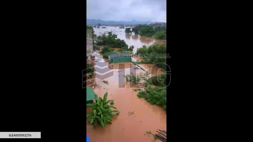 China: Rescuing Two Dogs During Flood in Ningming