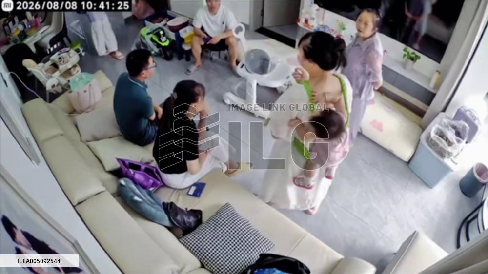 China: Woman Catches Baby Moments Before It Falls From Carrier